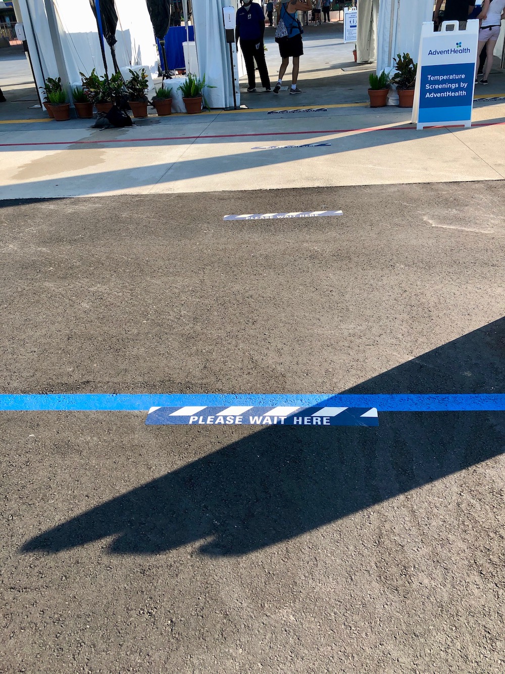 Ground markings to promote physical distancing at temperature screenings and throughout the Disney Parks. 