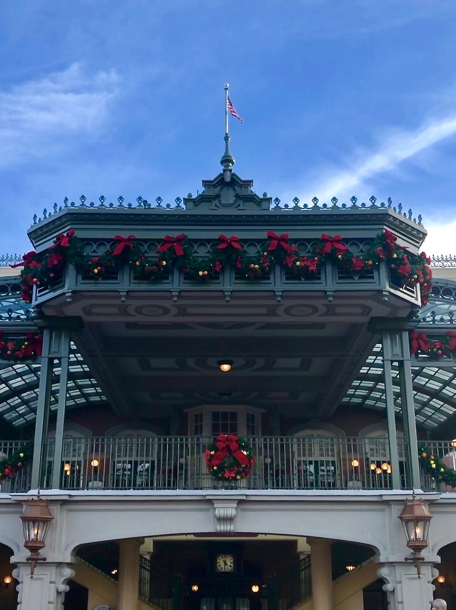 Magic Kingdom's Train Station is proudly displaying it's Cheery Christmas Decor