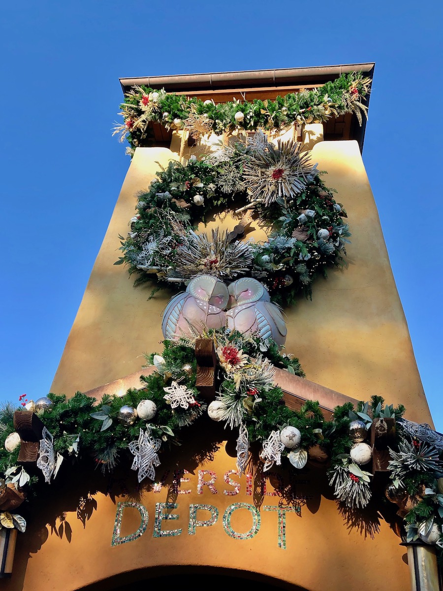 Curated holiday decorations illuminate Discovery Island at Animal Kingdom. 