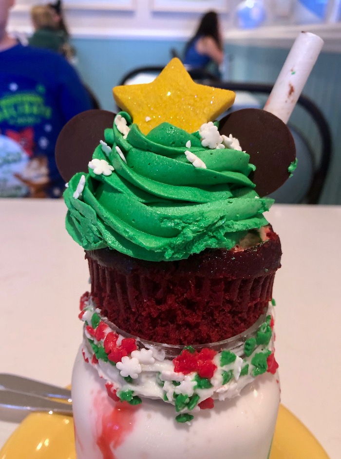 The Beaches and Cream Holiday Shake is topped off with a red velvet cupcake!